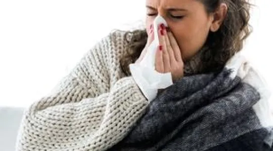 sneezing woman