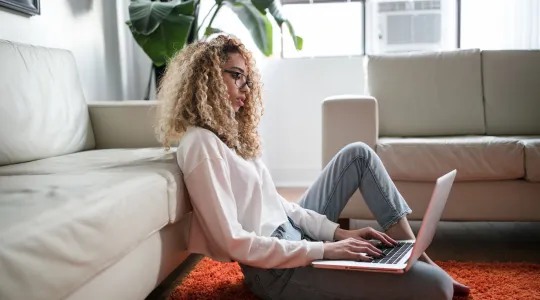 Woman makes plans on her laptop