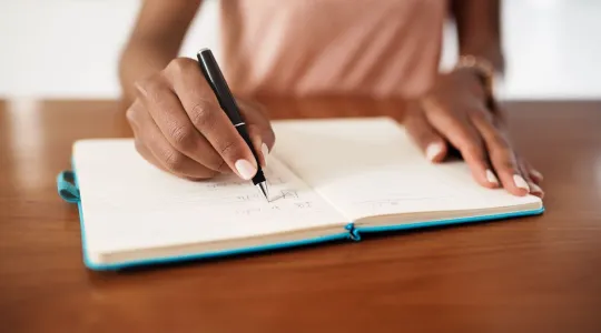 Woman creating a task list