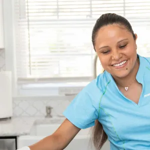 Merry Maids team member cleaning counters