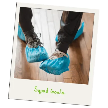 Merry Maids of York professional housekeepers wearing protective shoe covers on a hardwood floor