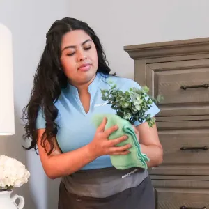 Merry Maids cleaner with vase